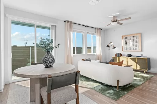 Furnished living room with dining room table